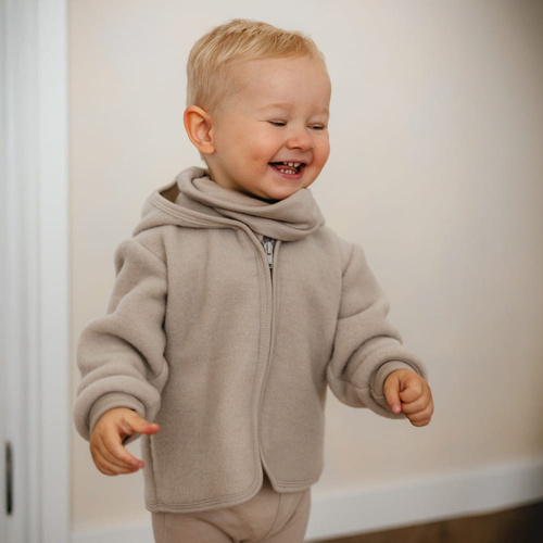 Eevi Kinderjacke aus Merinowolle – beige, atmungsaktiv und weich